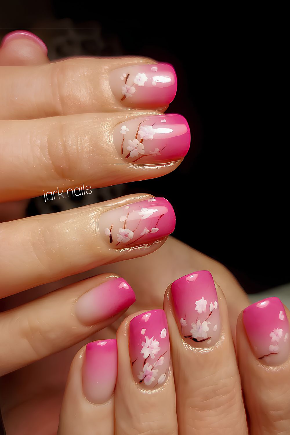 Hot pink ombre nails with sakura art