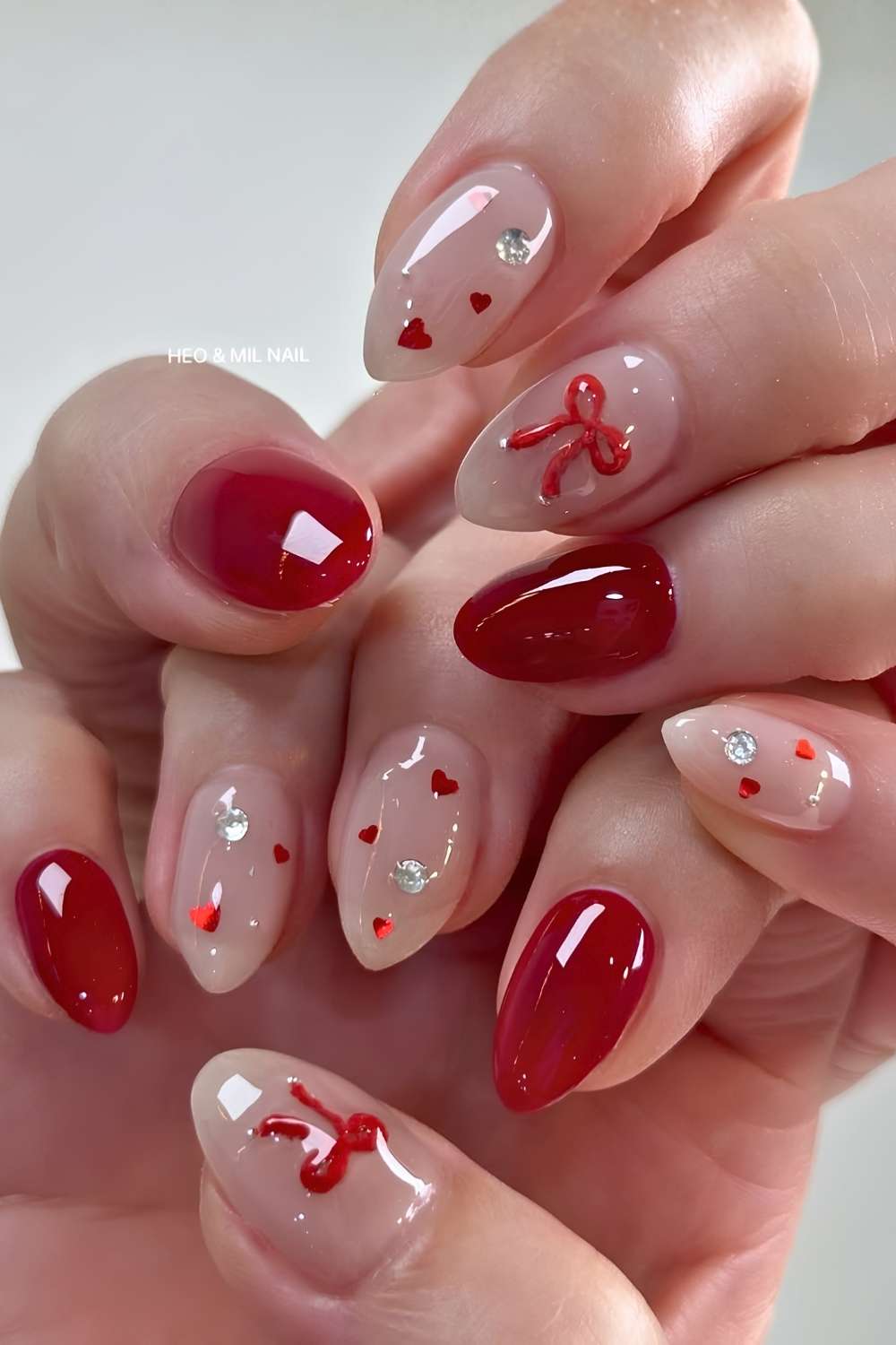 Jelly red nails with bows and hearts