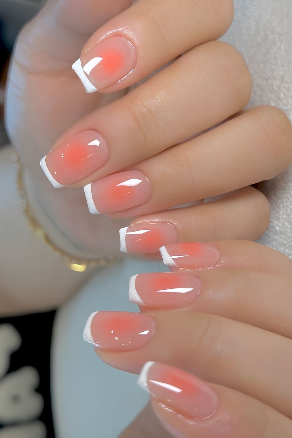 Jelly white French mani with peach aura effect