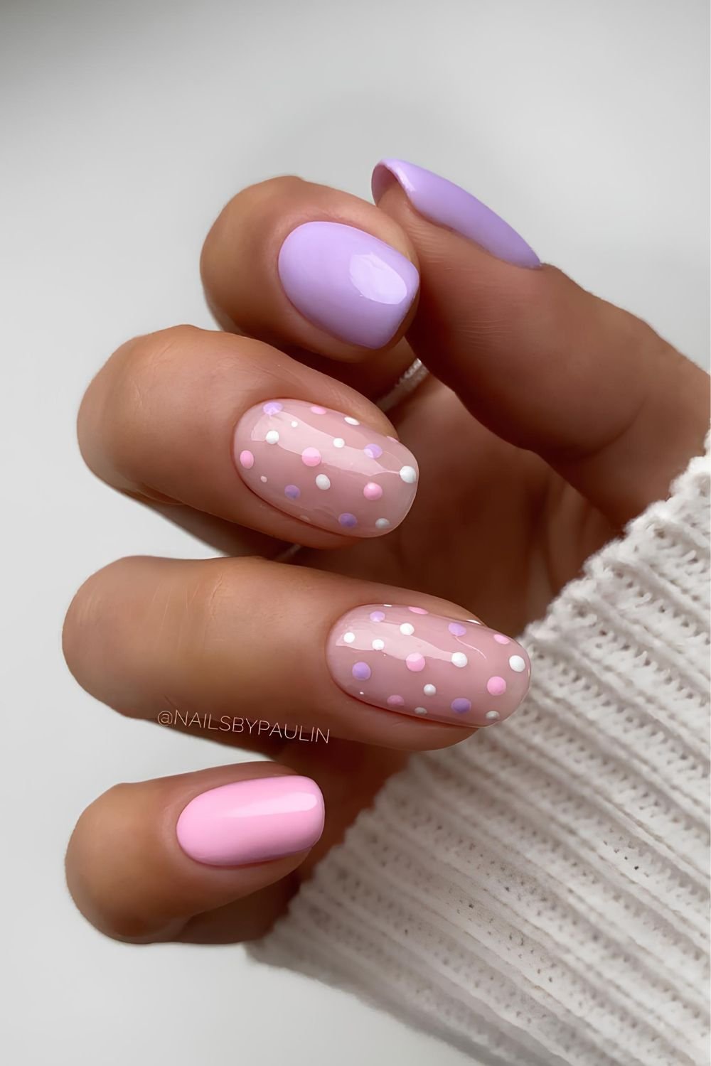Lavender and light pink nails with dot accents