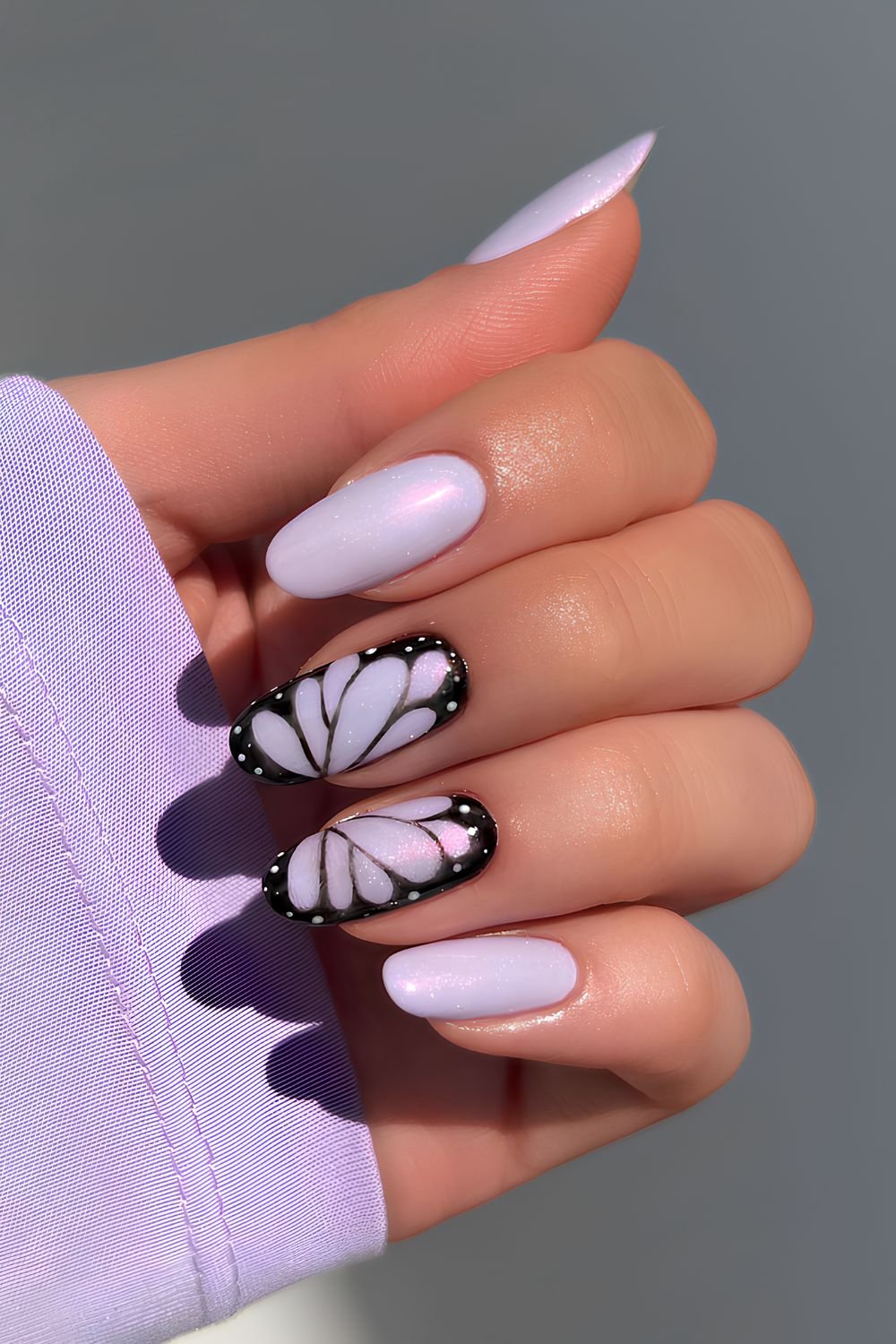 Lavender nails with black butterfly art