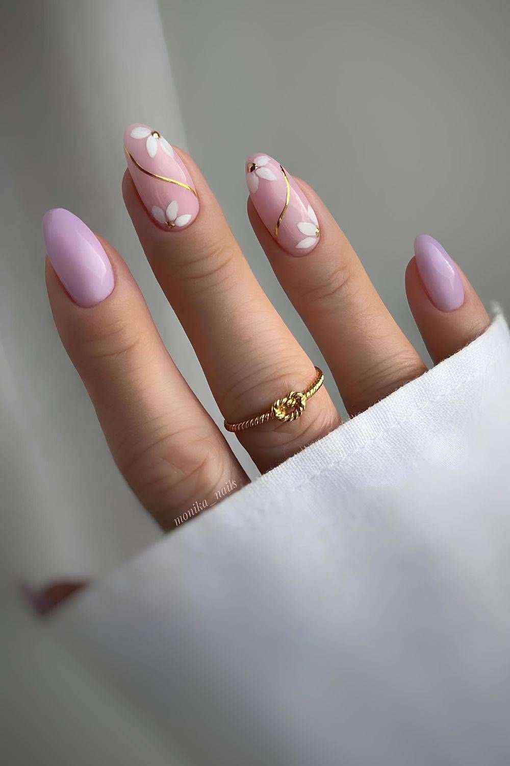 Lavender nails with floral accents and gold lines