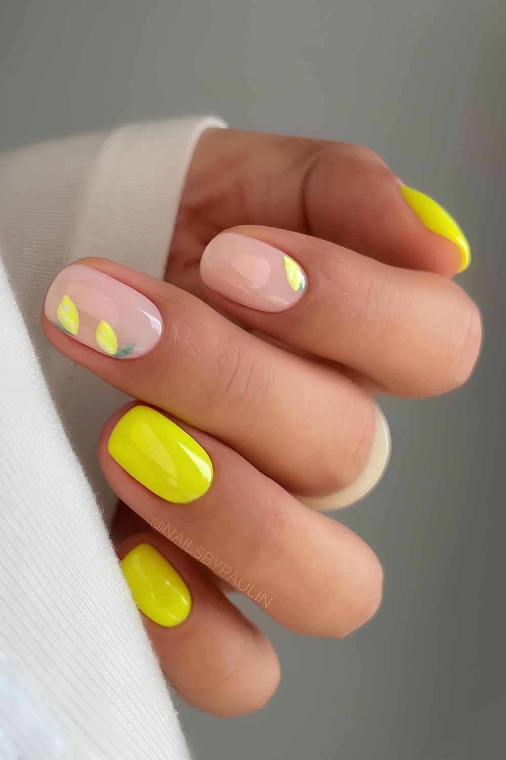 Lemon yellow and milky white nails with lemon fruit accents