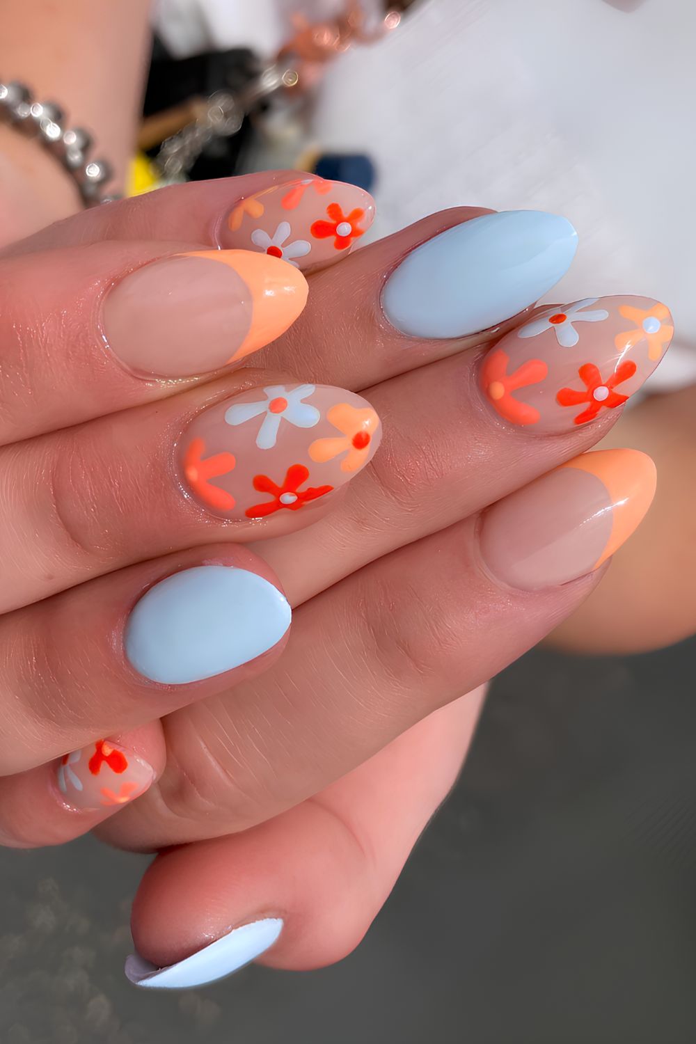 Light blue and orange floral nails