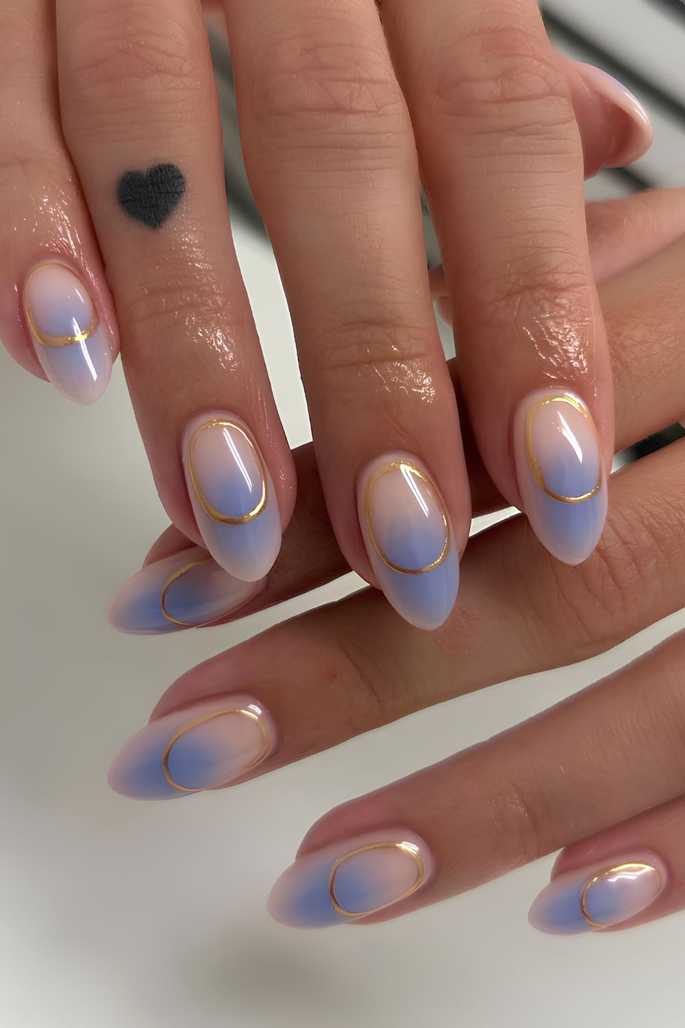 Light blue aura nails with gold details