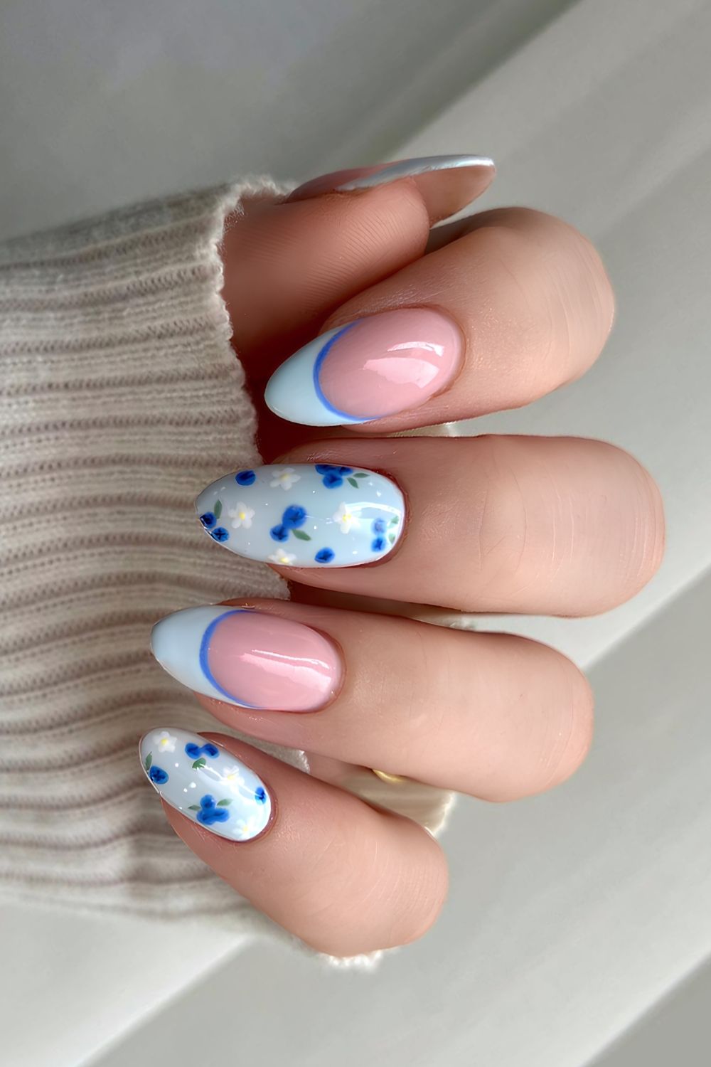 Light blue nails with blueberries and flowers
