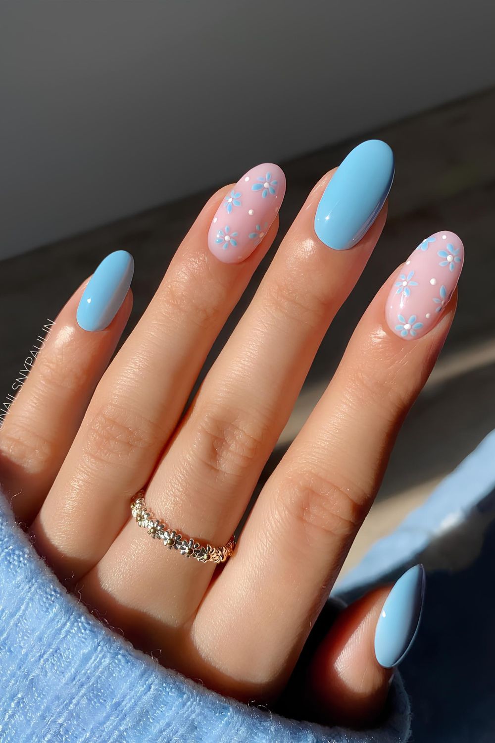 Light blue nails with floral accents