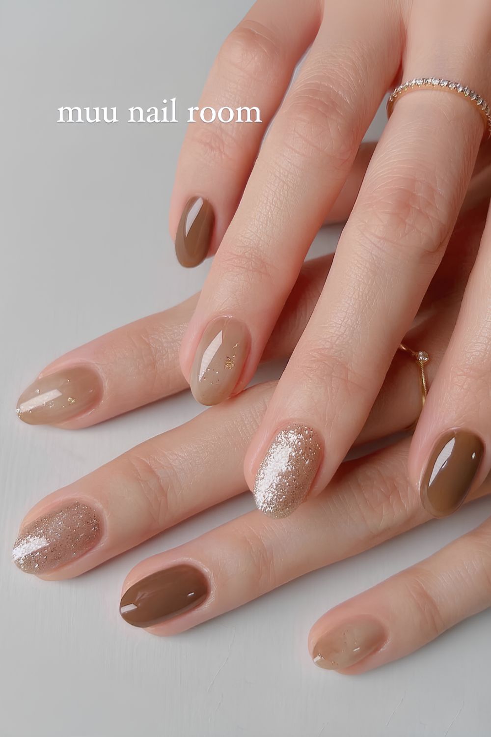 Light brown nails with accent glitter