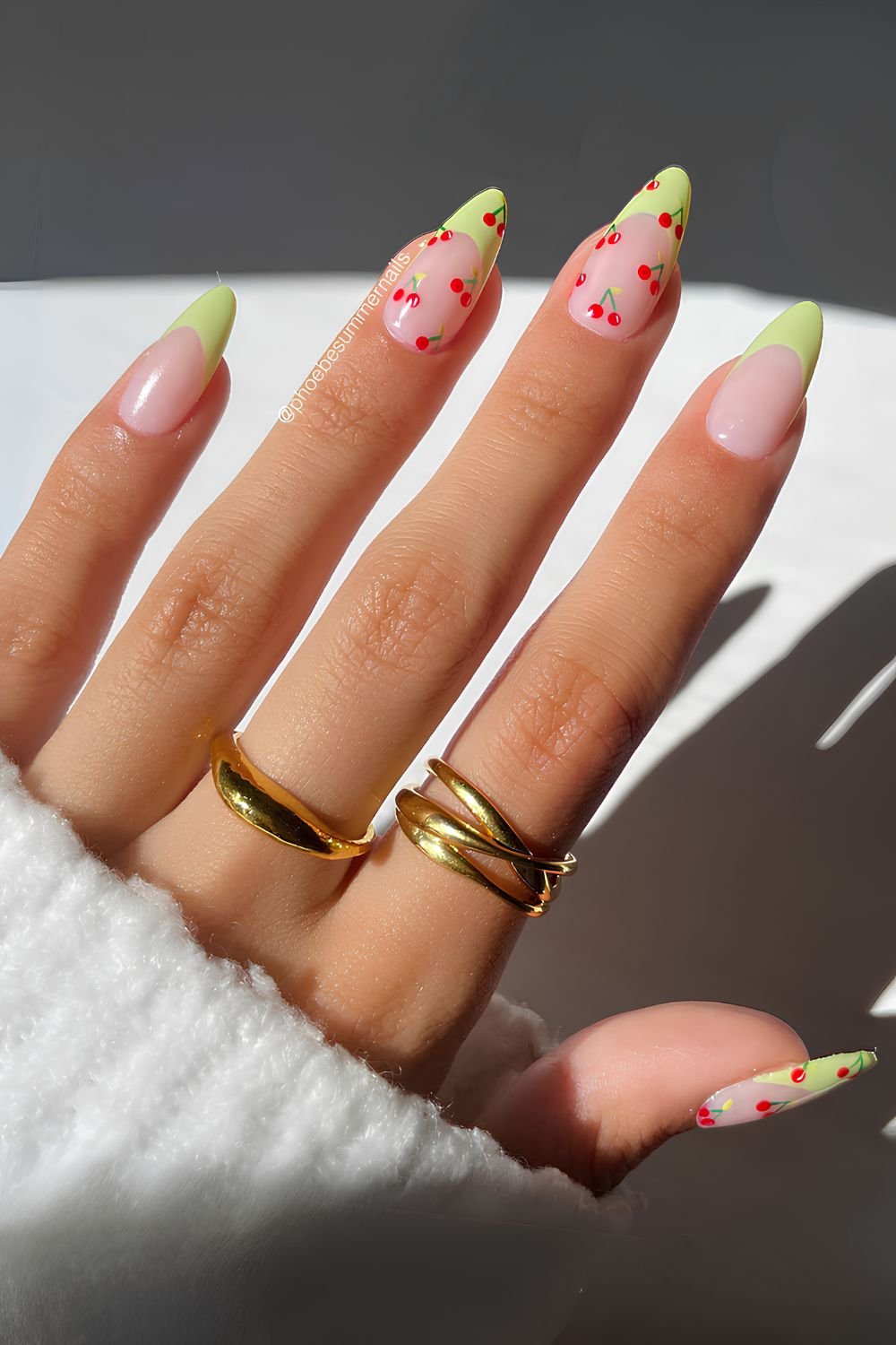Light green French nails with cherries