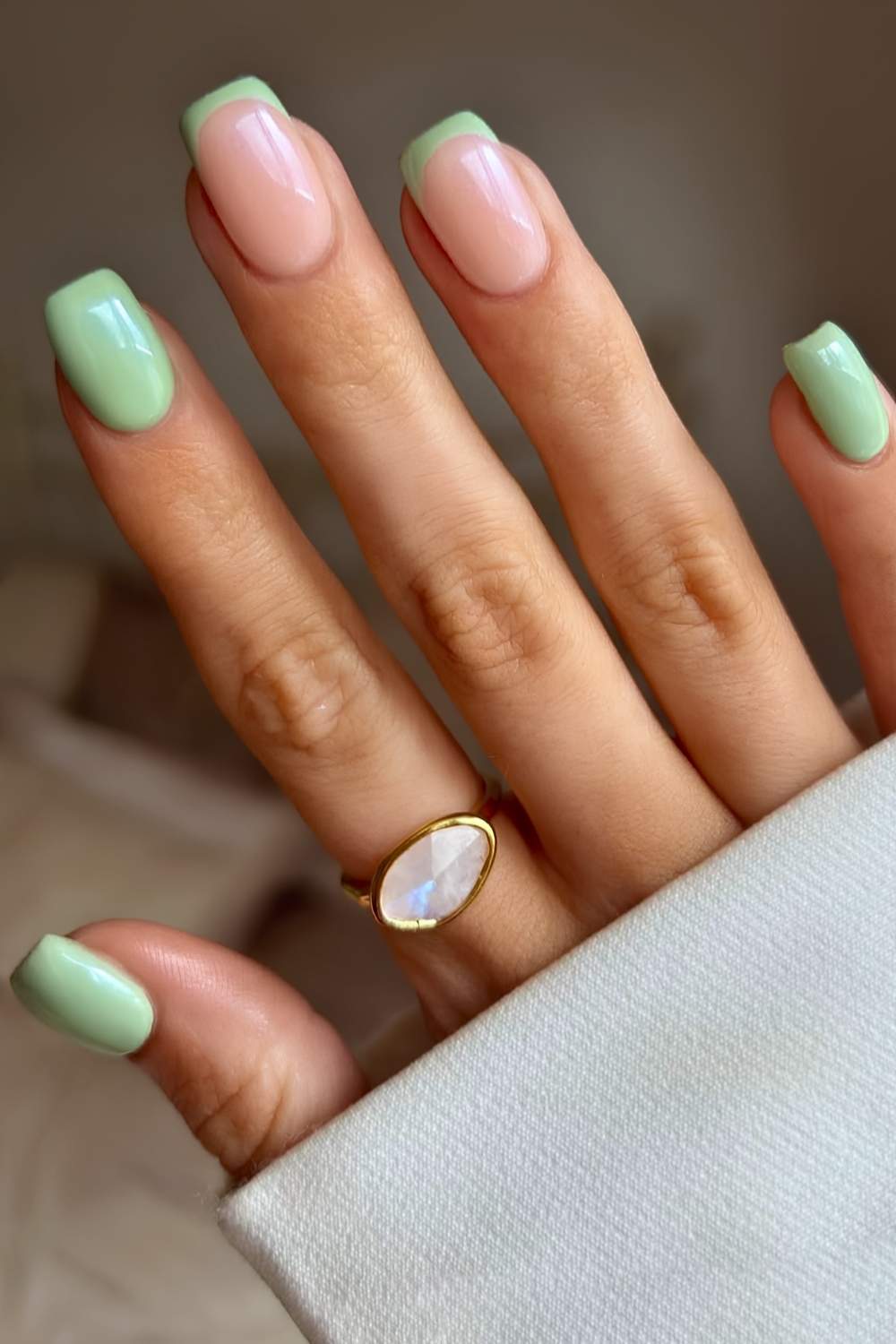 Light green nails with accent French tips