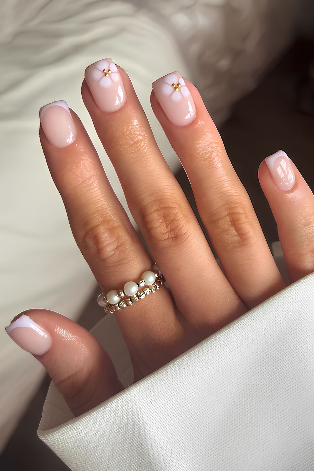 Light lavender nails with blooming flower accents