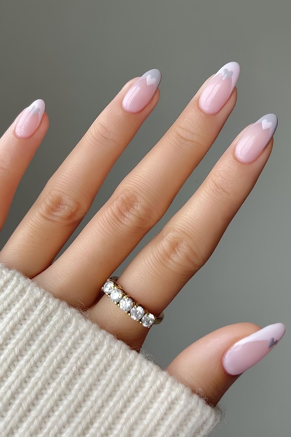 Light pink and gray pastel French nails with heart accents