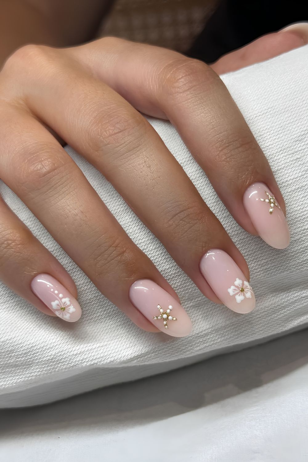 Light pink nails with hibiscus and starfish nail art