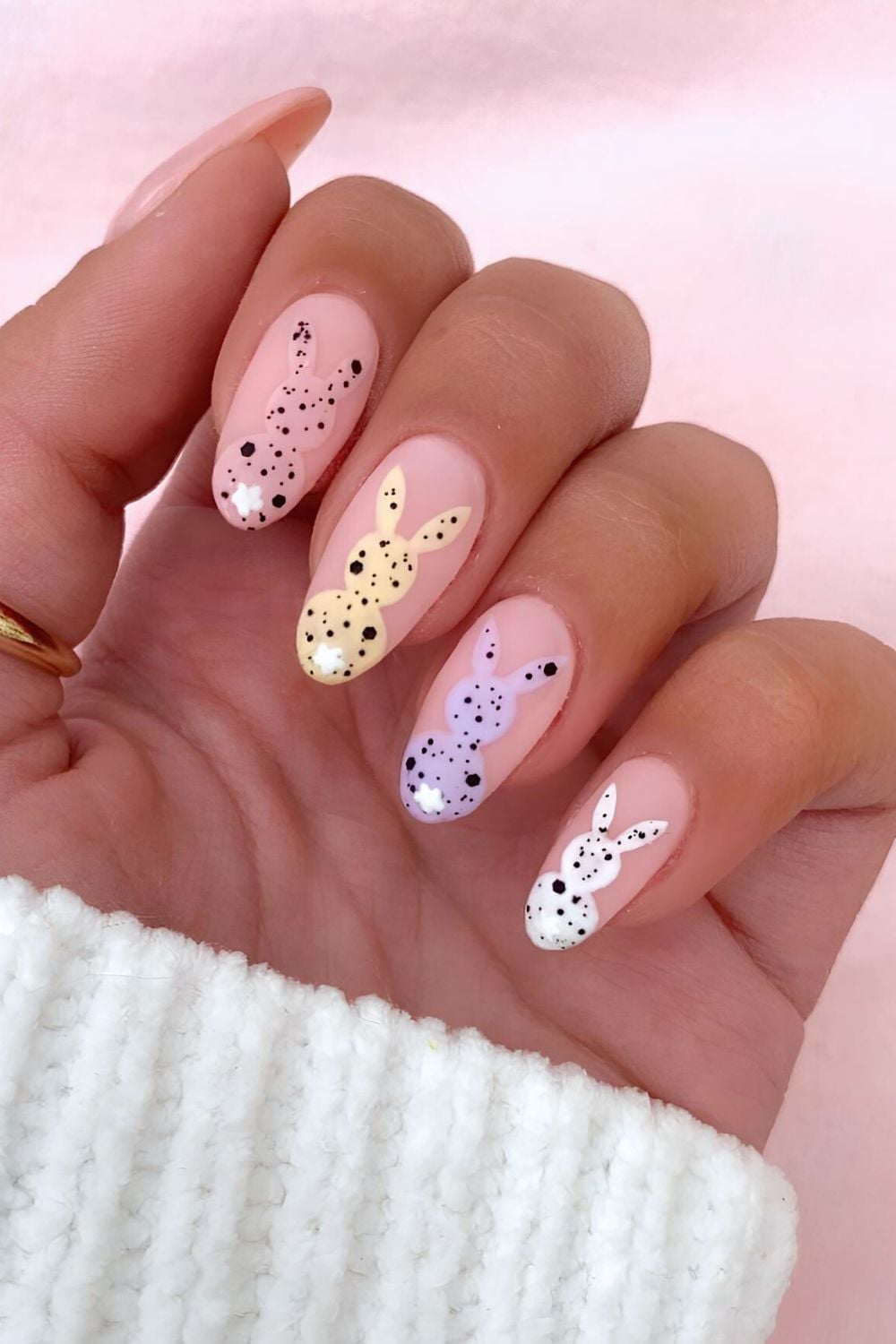 Matte neutral nails with speckled bunny accents