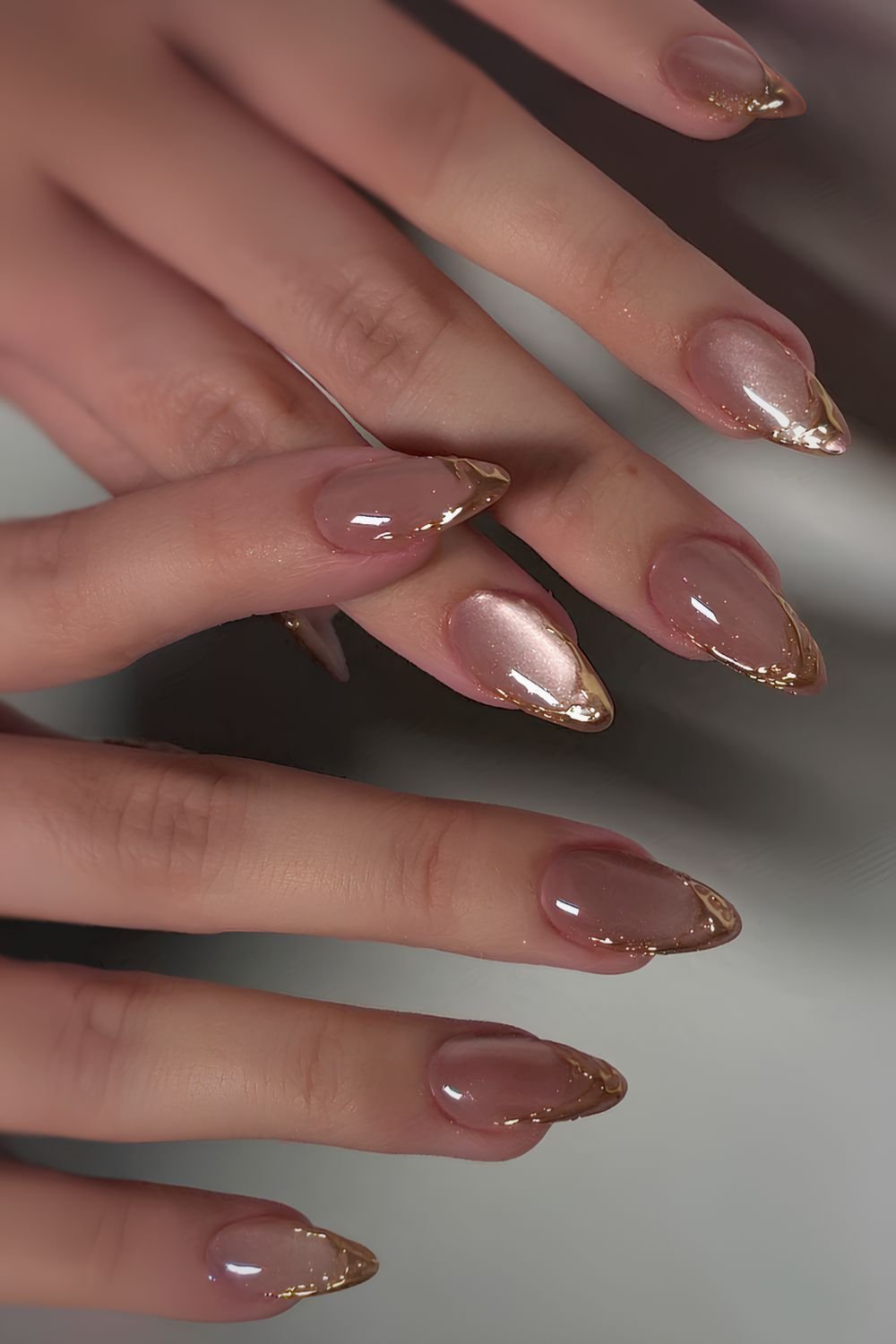Mauve cat eye nails with gold French tips