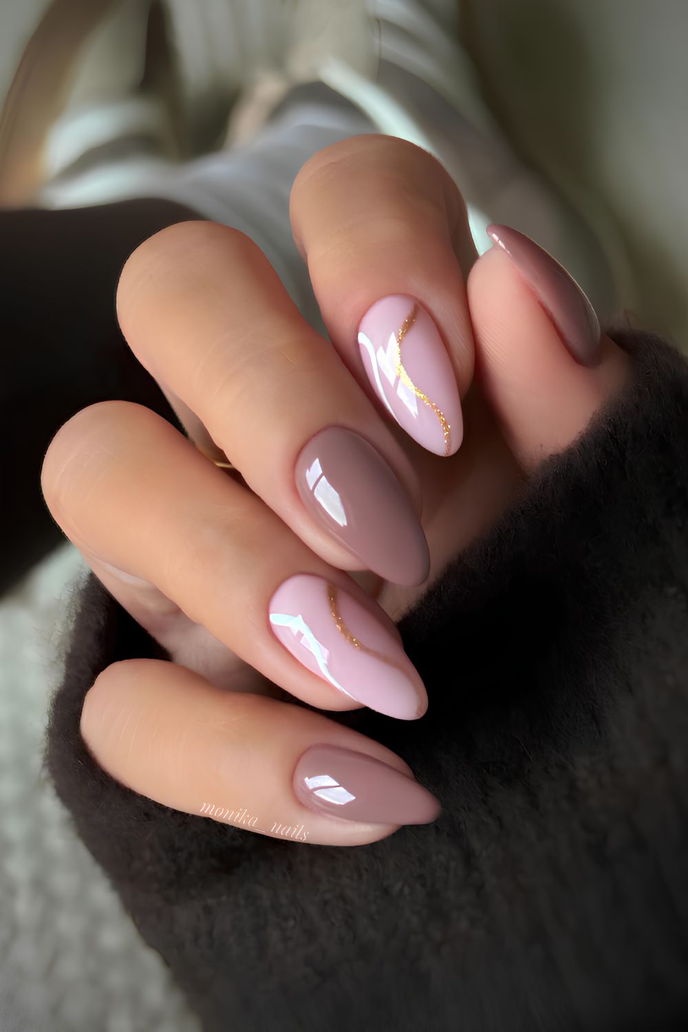 Mauve nails with glitter and swirl accents