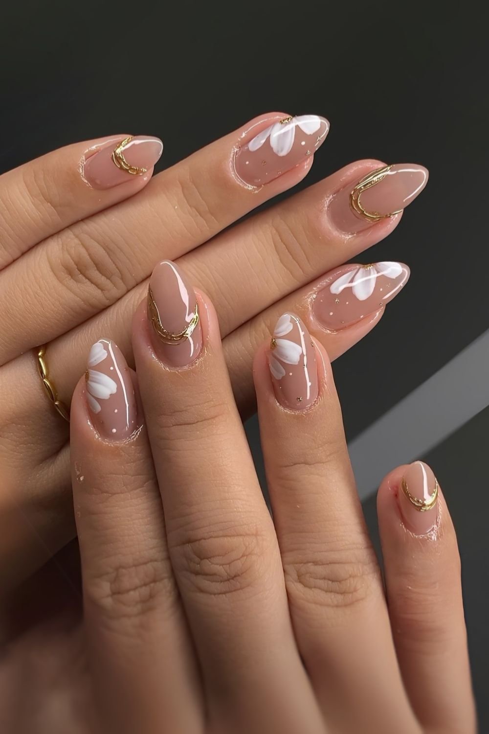 Mauve nails with gold and daisy accents