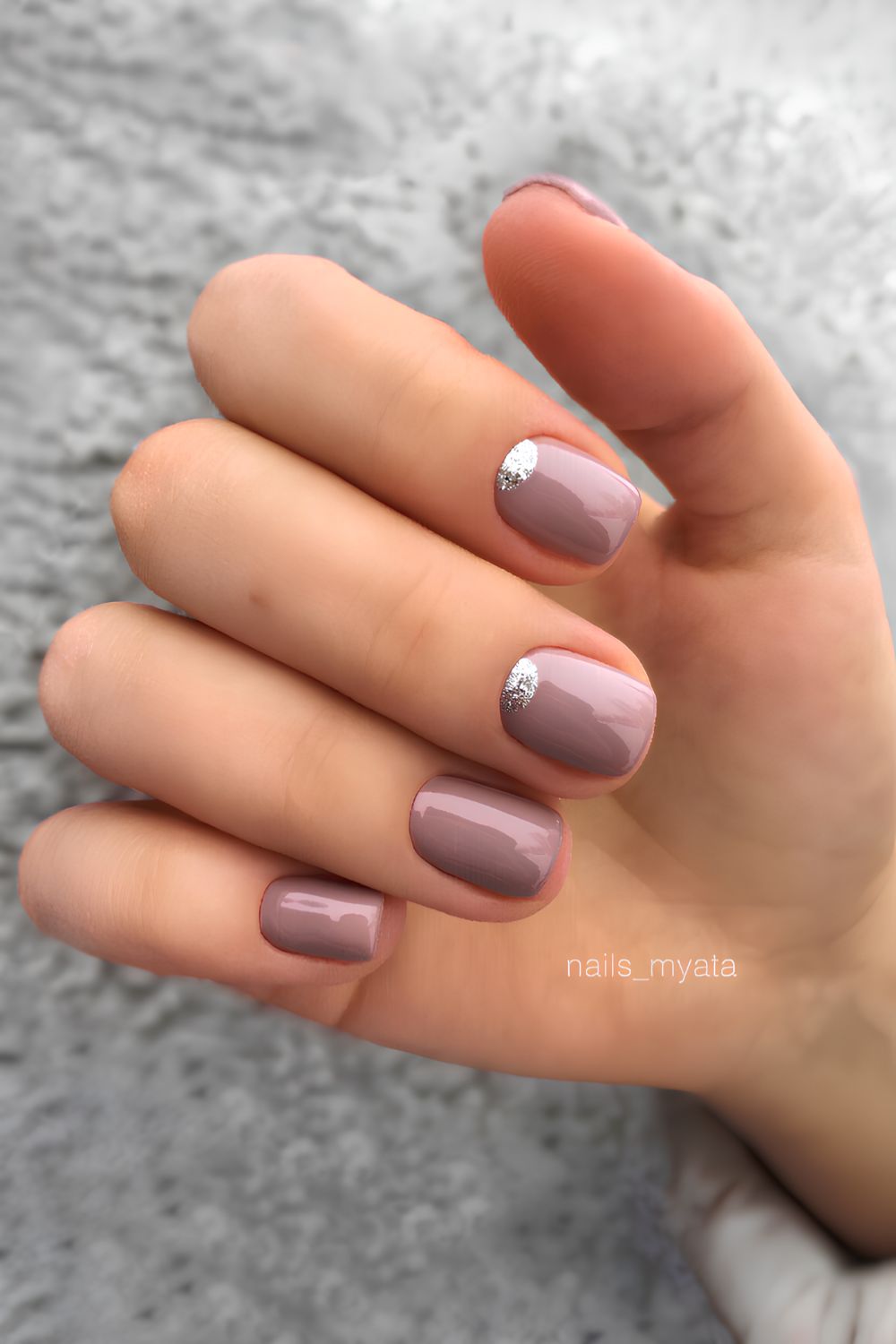 Mauve nails with half-moon accent