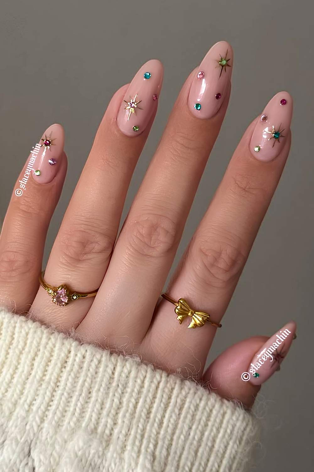 Milky Christmas nails with colorful rhinestones