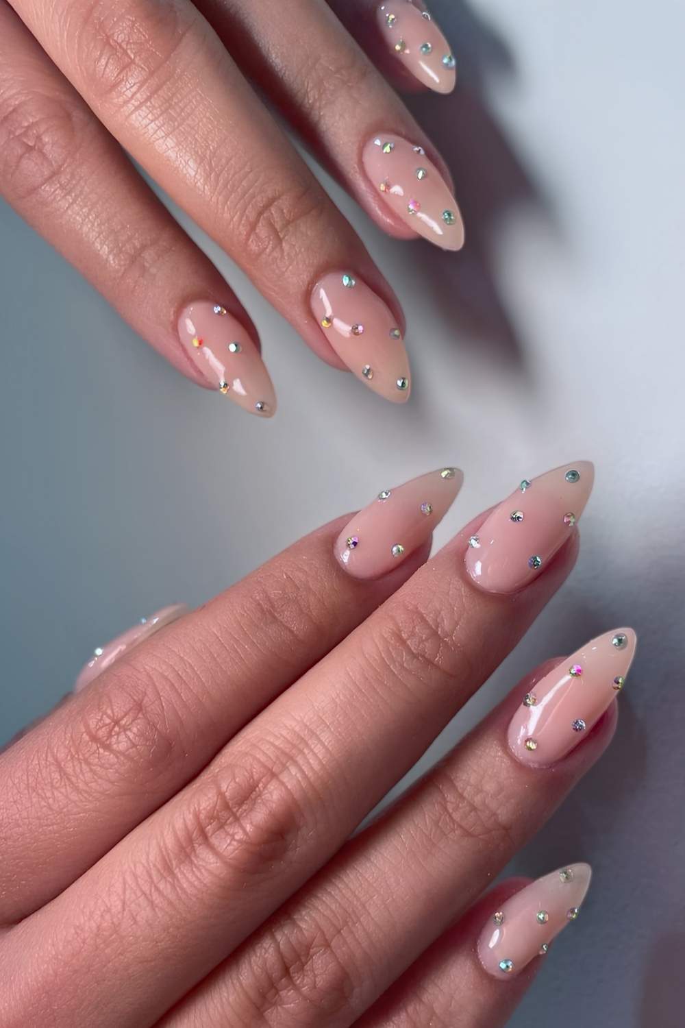 Milky mani with rhinestone studs