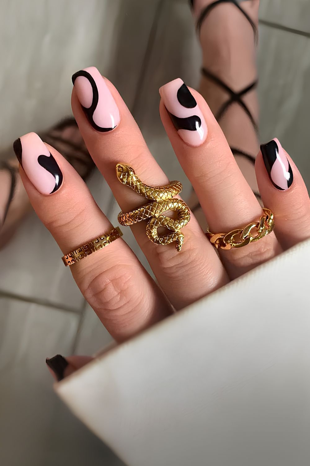 Milky nails with abstract black shapes