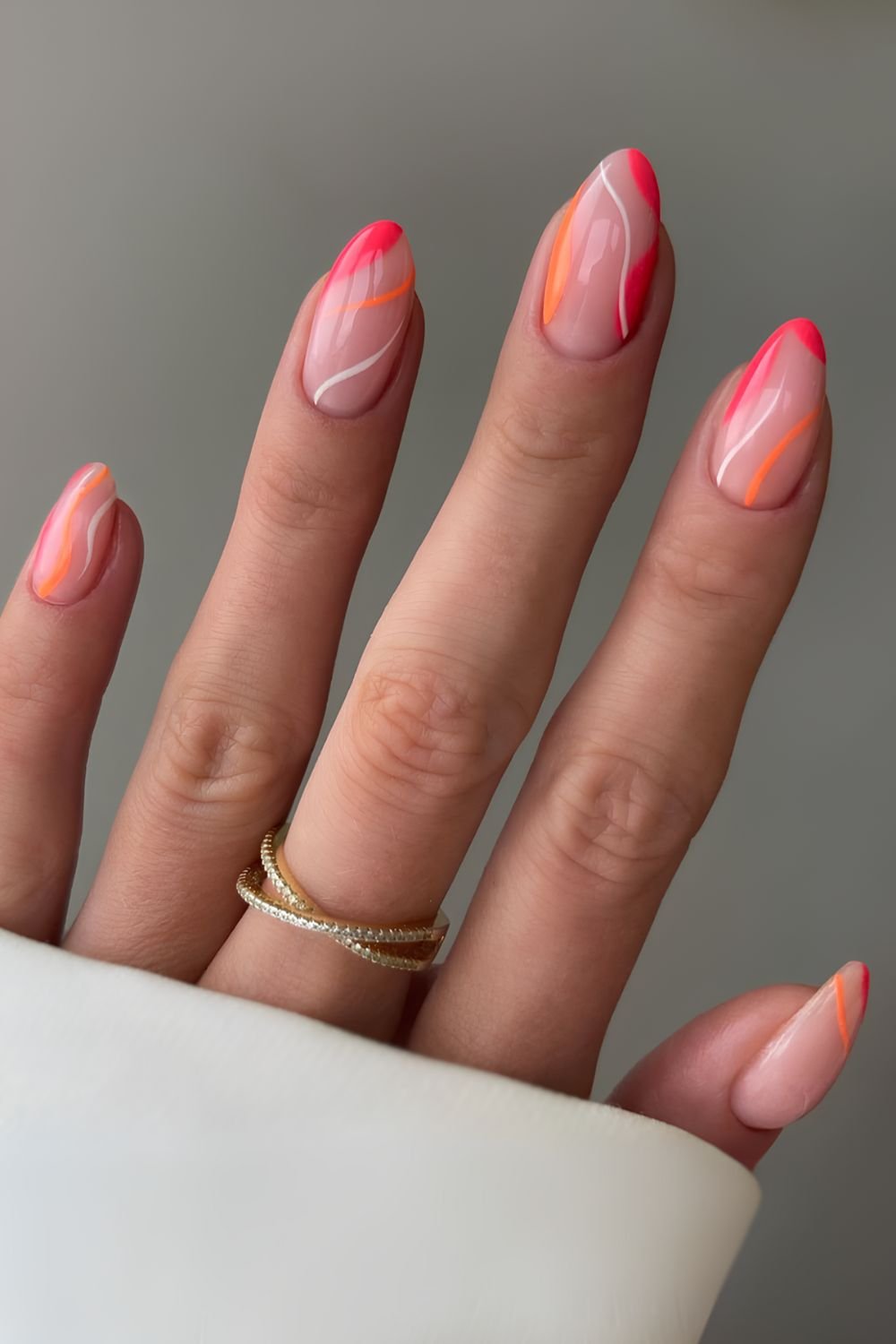 Milky nails with abstract pink and orange lines