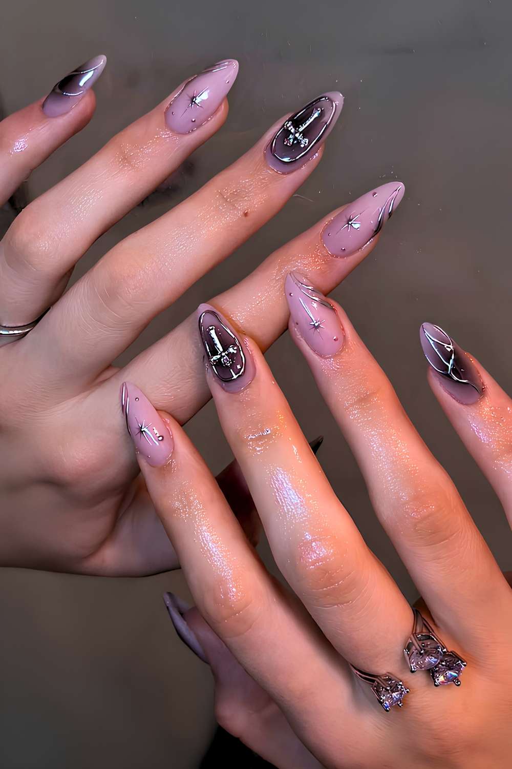 Milky nails with black aura and silver star accents