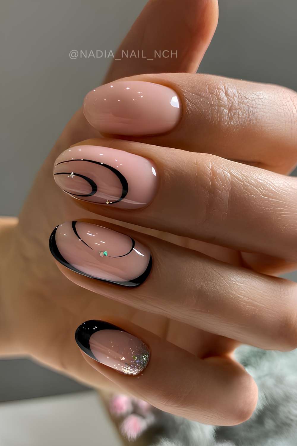 Milky nails with black swirl art