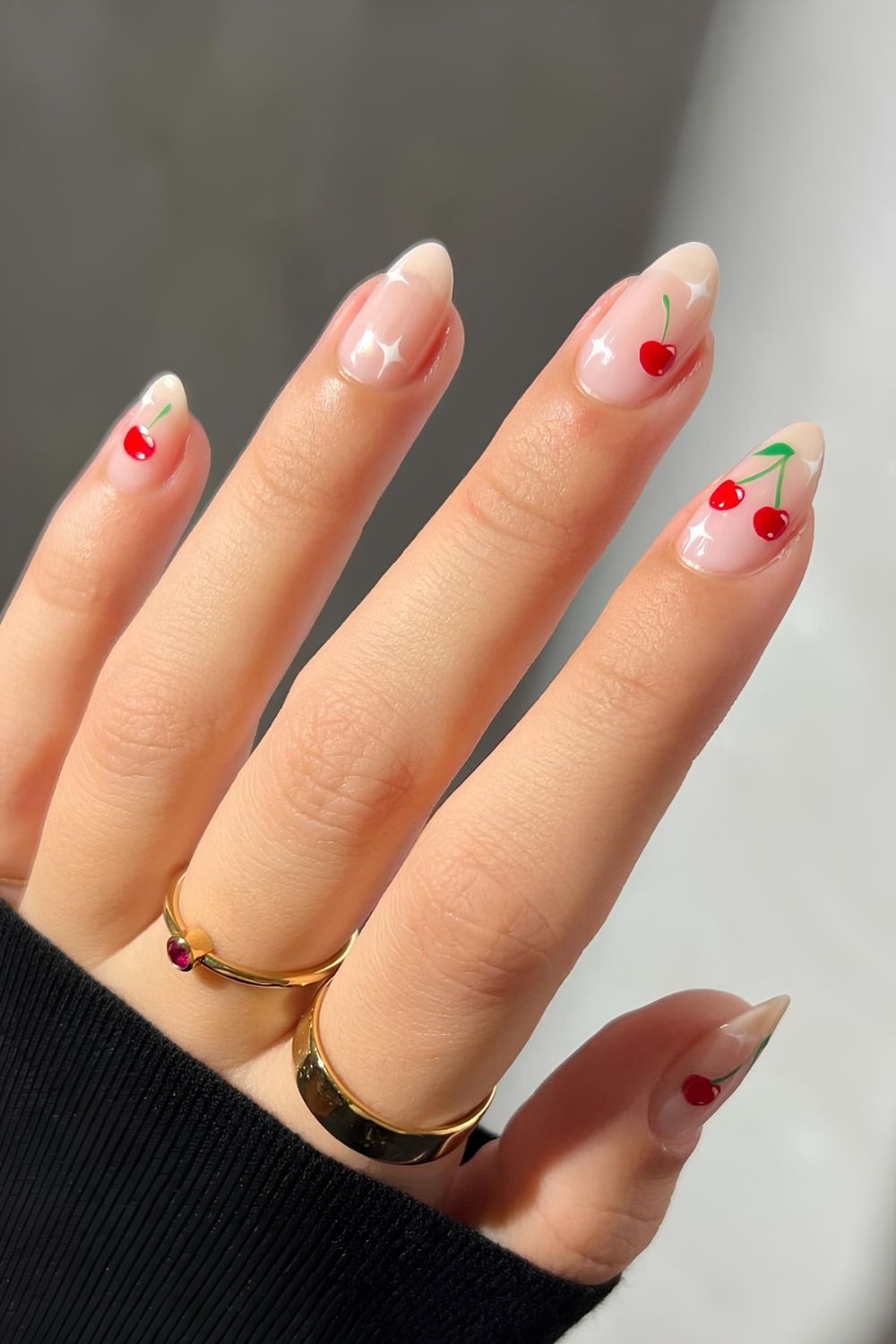 Milky nails with cherry and star accents