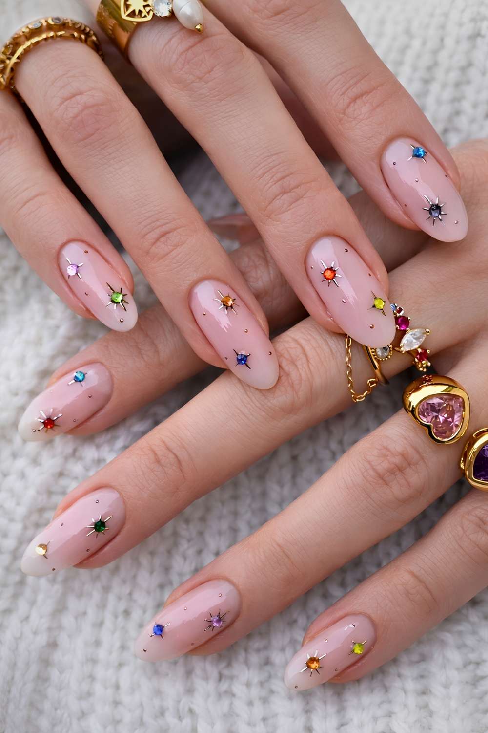 Milky nails with colorful gems