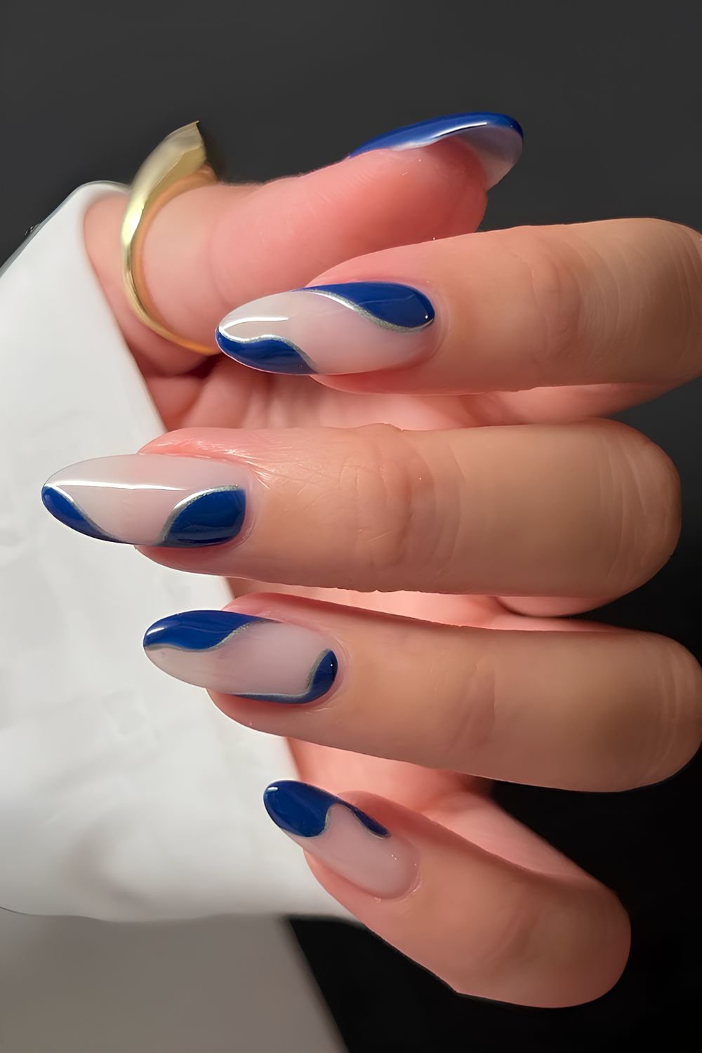 Milky nails with deep blue abstract art