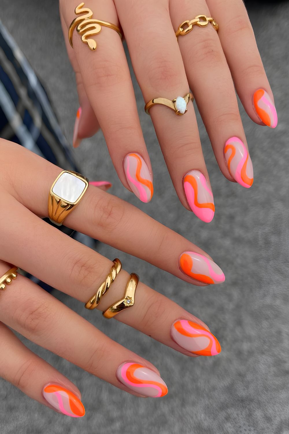 Milky nails with funky pink and orange swirls