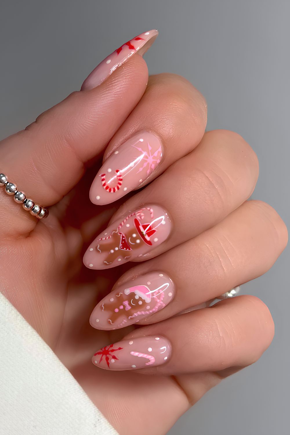 Milky nails with gingerbread and candy cane art
