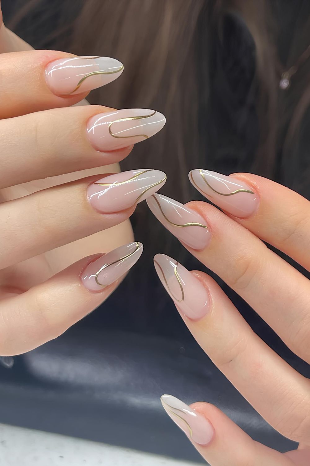 Milky nails with goold chrome swirls