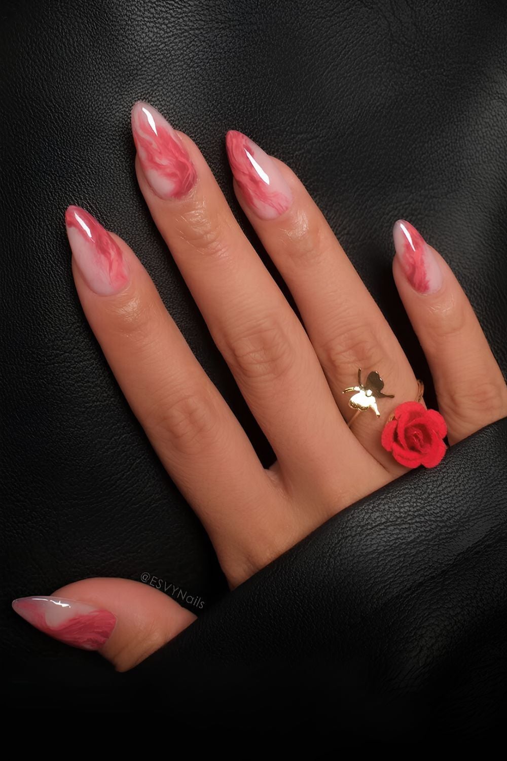Milky nails with red marble swirls