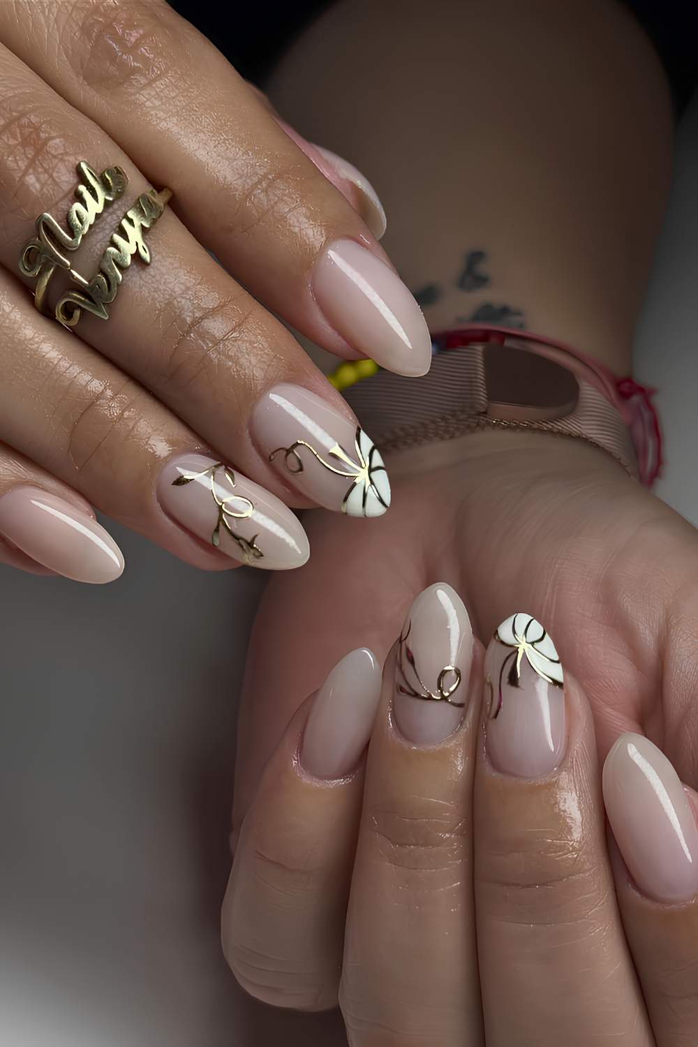 Milky nails with white and gold pumpkin art