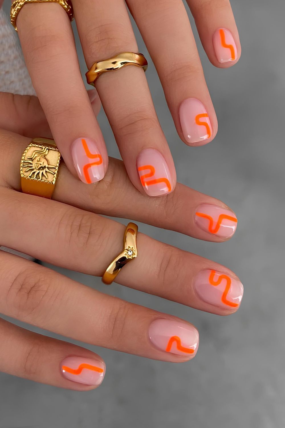 Milky pink base with orange abstract squiggles