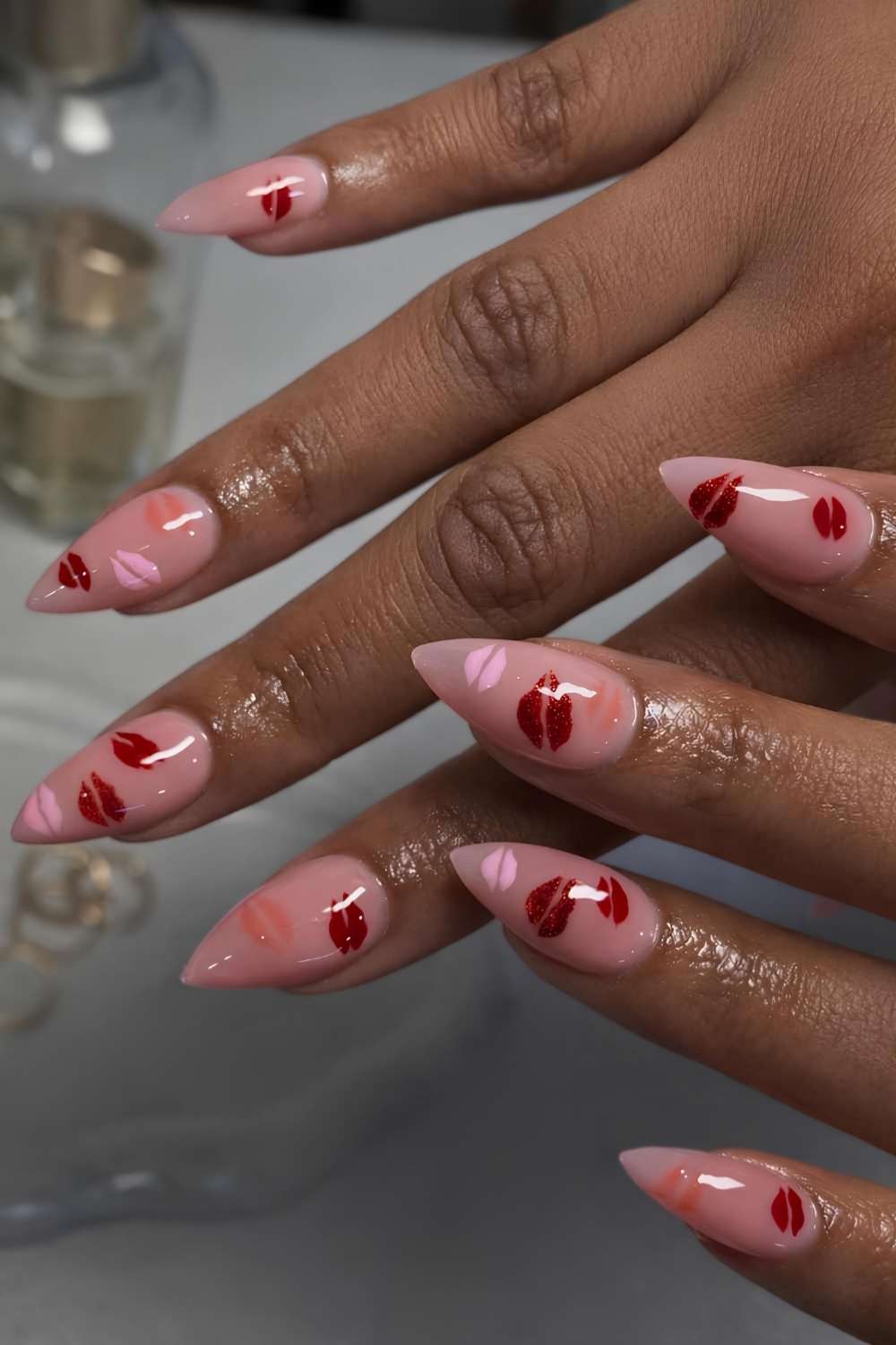 Milky pink manicure with kiss art