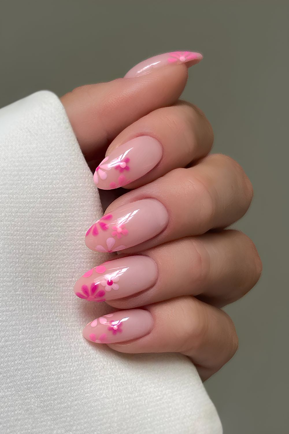 Milky pink nails with floral art in different pink shades
