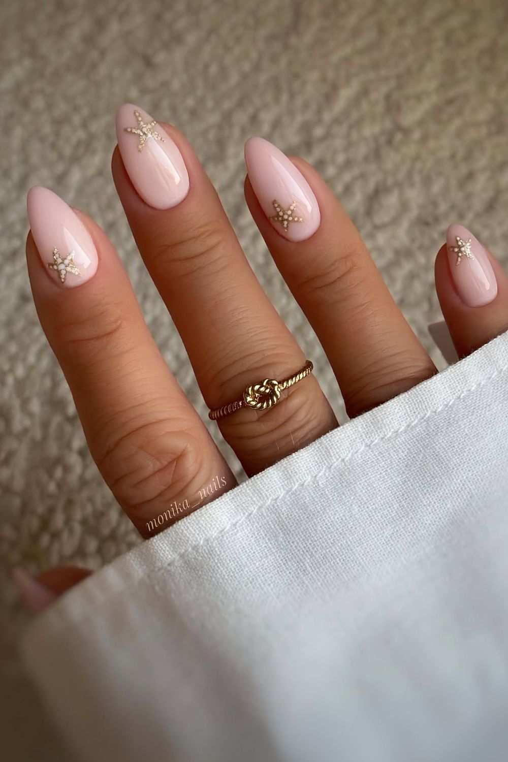 Milky pink nails with starfish art