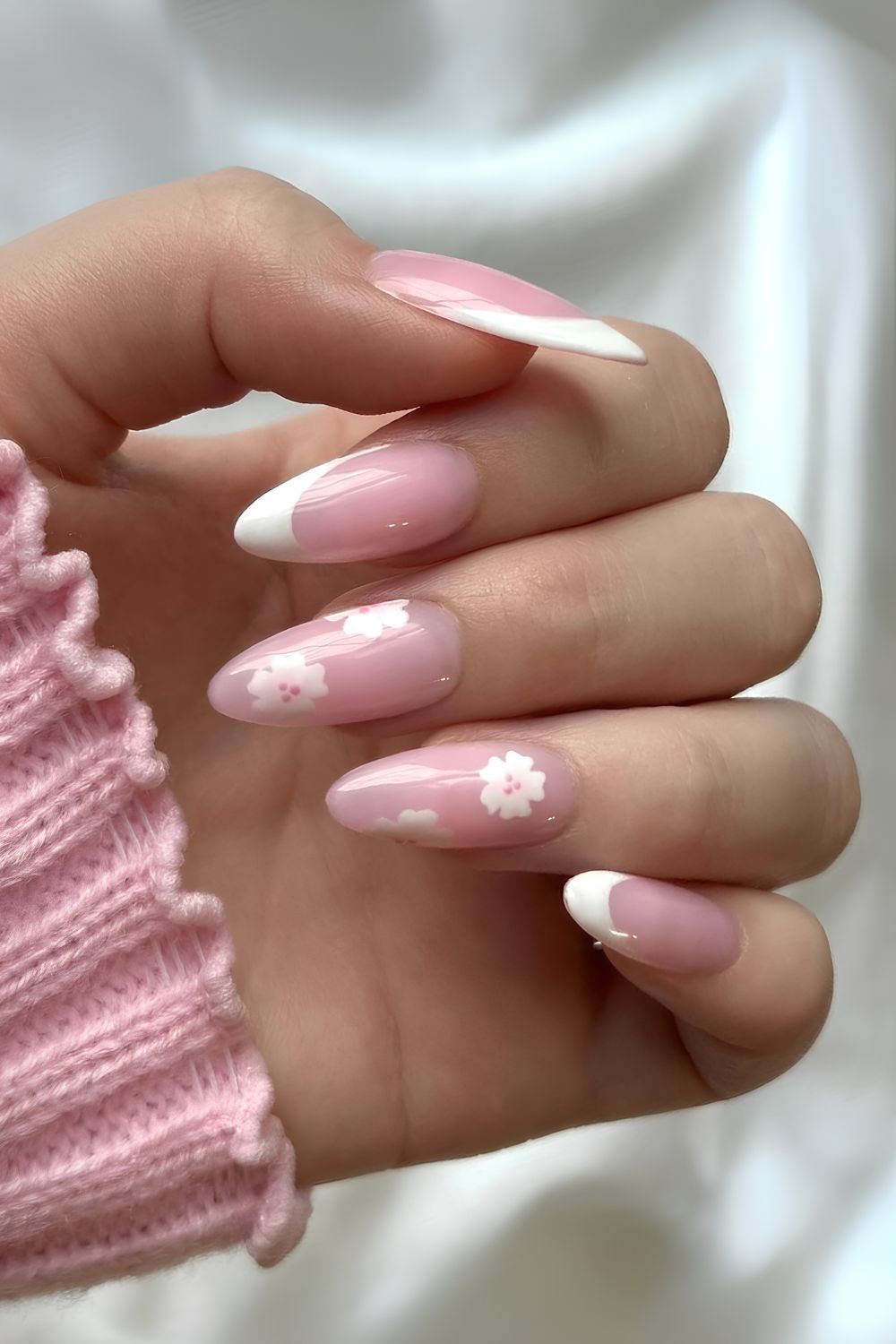 Milky pink nails with white French tips and flowers