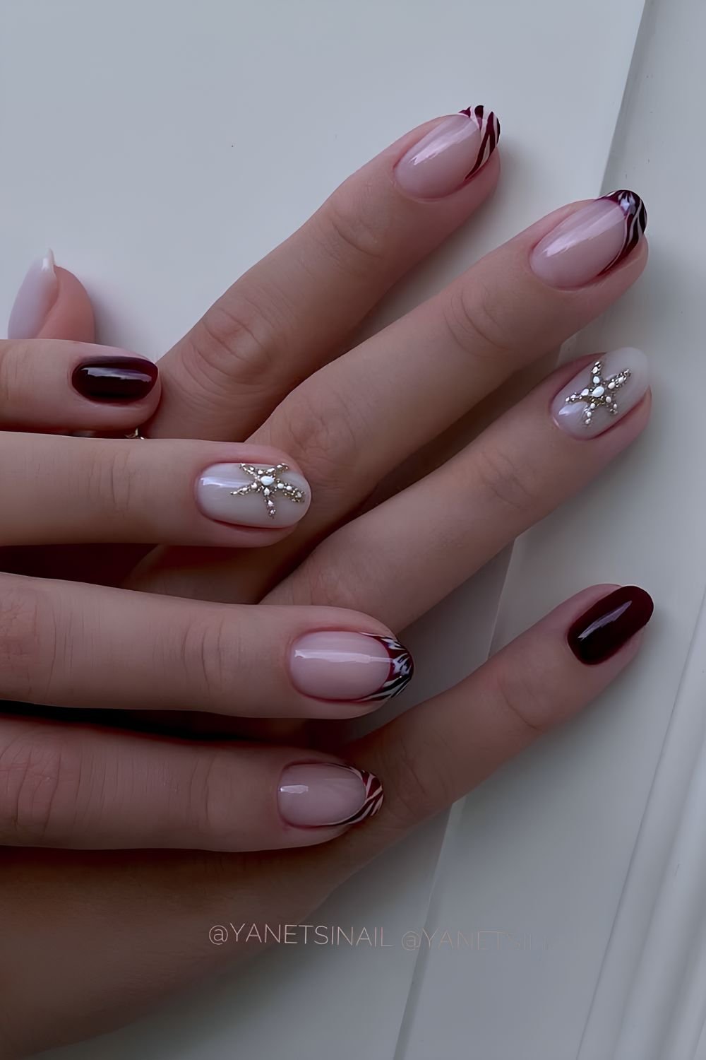 Milky white and brown nails with starfish accents