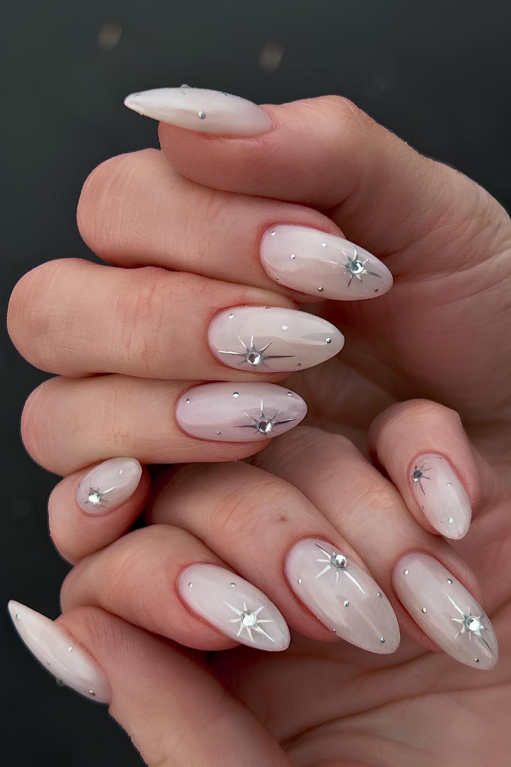 Milky white celestial mani with rhinestones