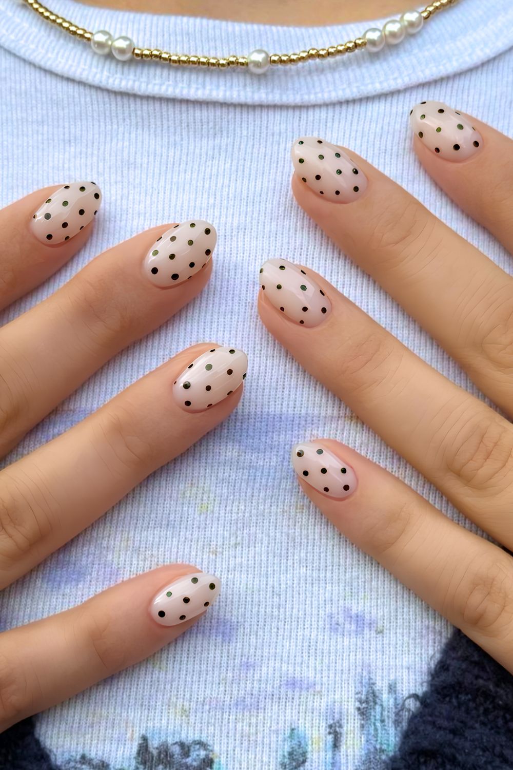 Milky white mani with black polka dots