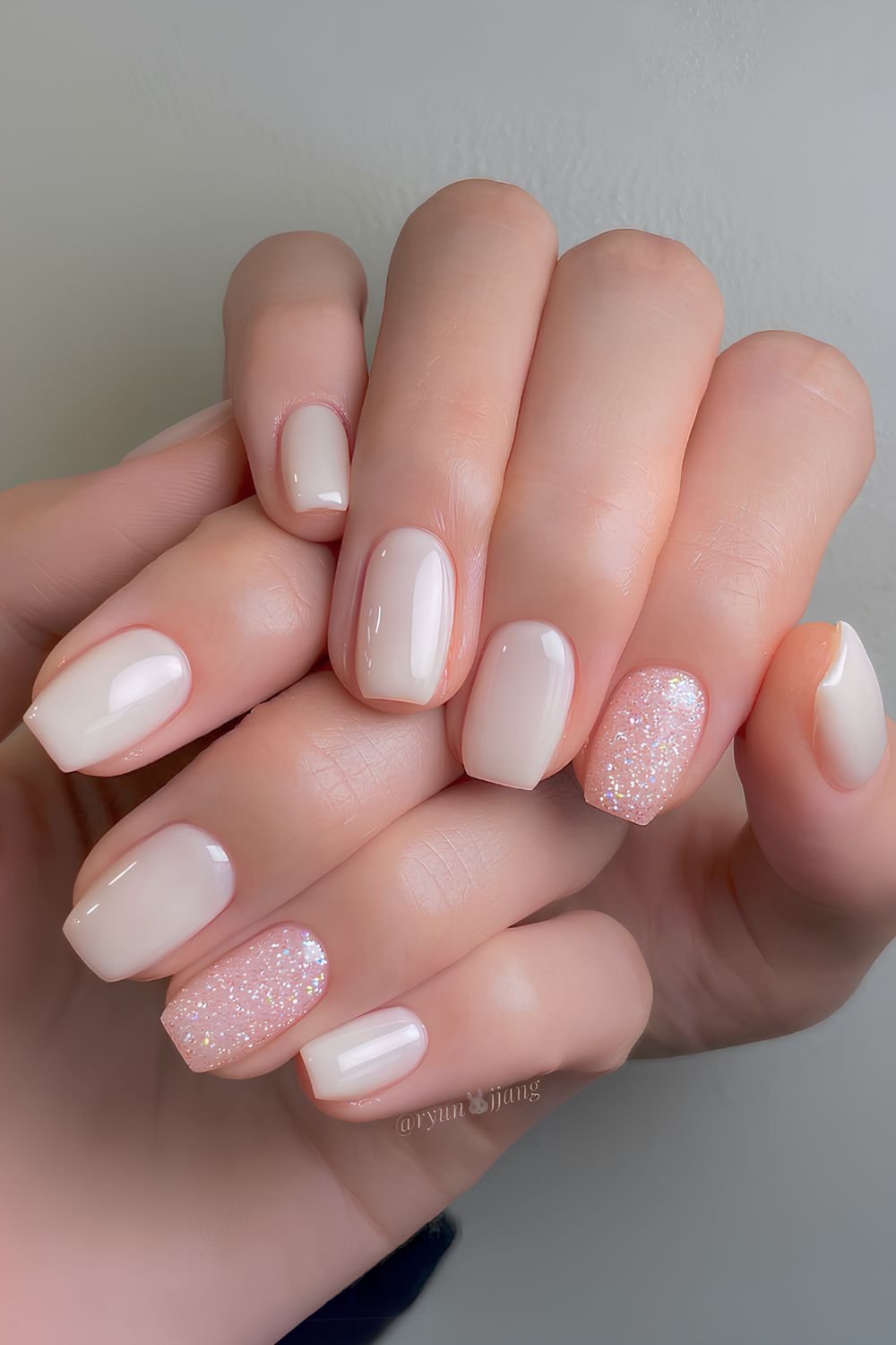 Milky white nails with accent glitter