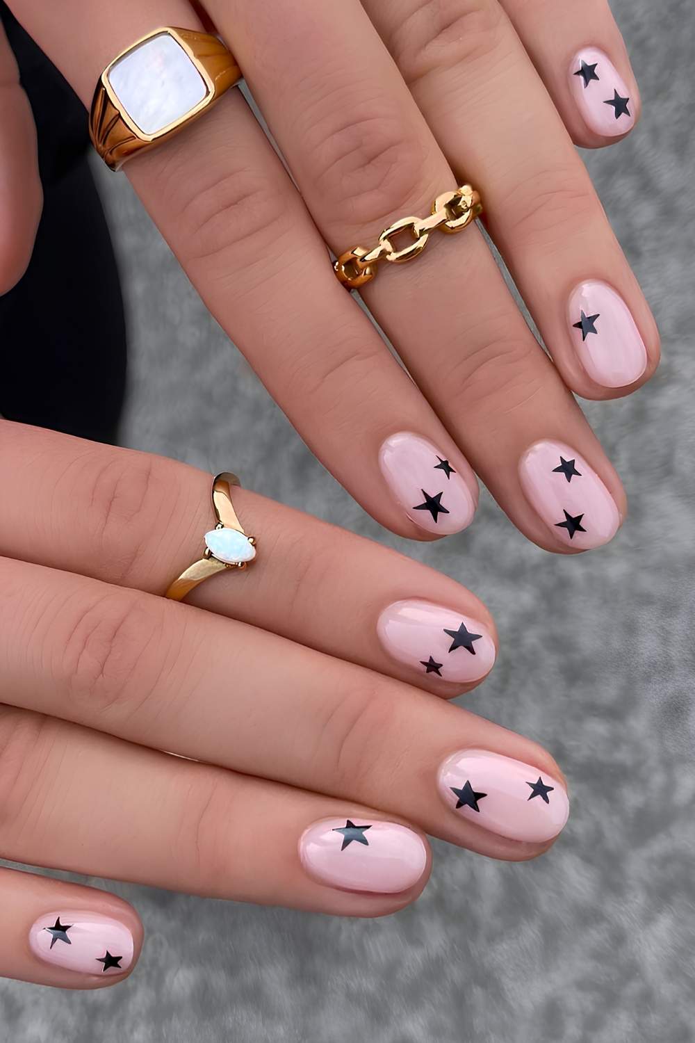 Milky white nails with black star art