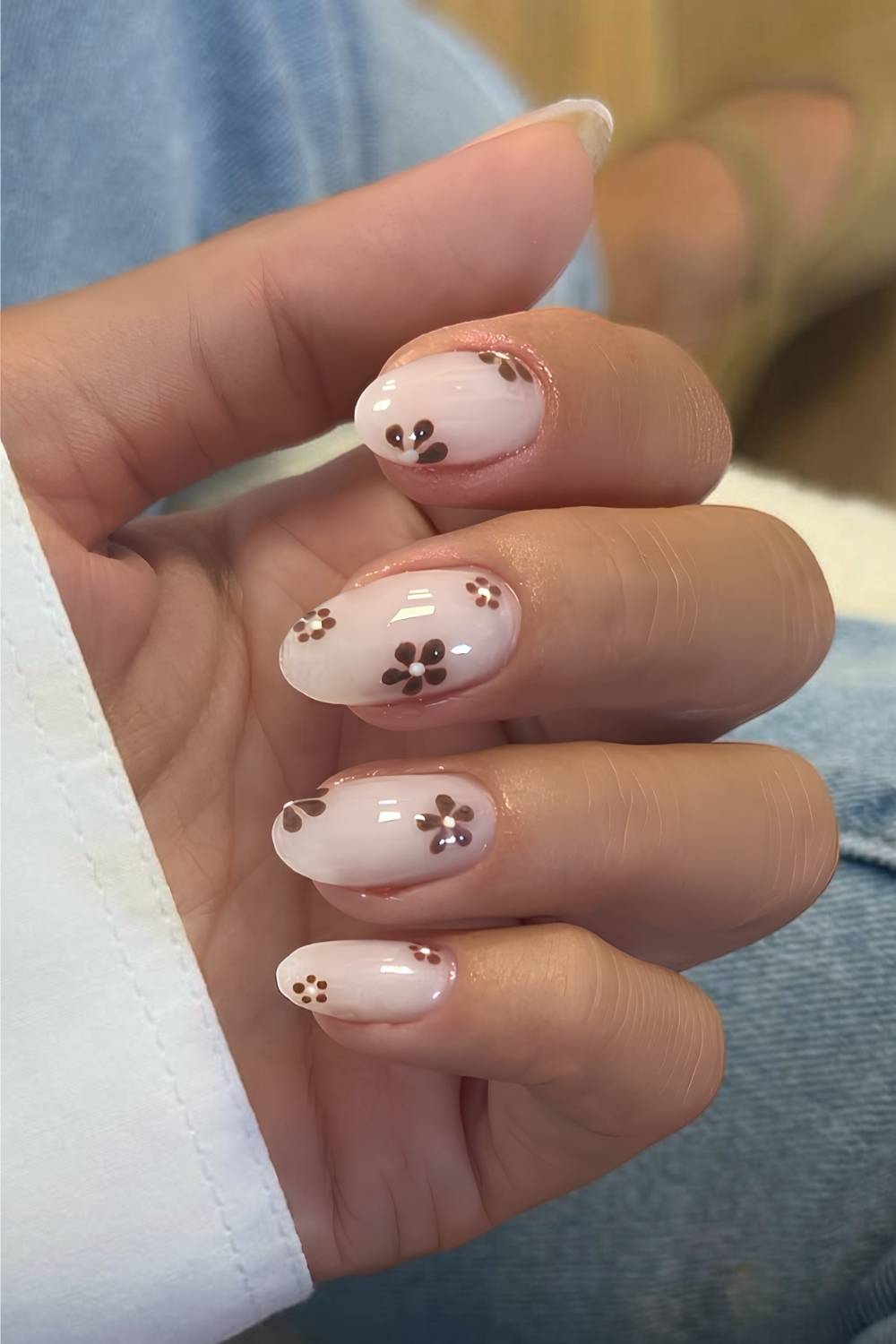 Milky white nails with brown floral art
