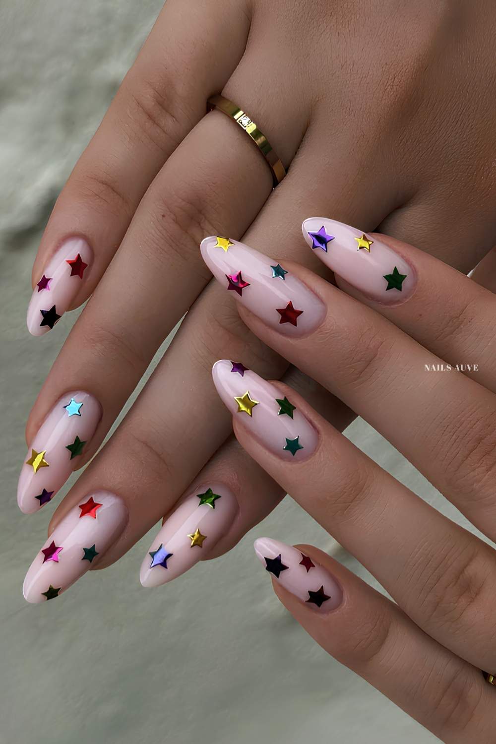 Milky white nails with colorful chrome stars