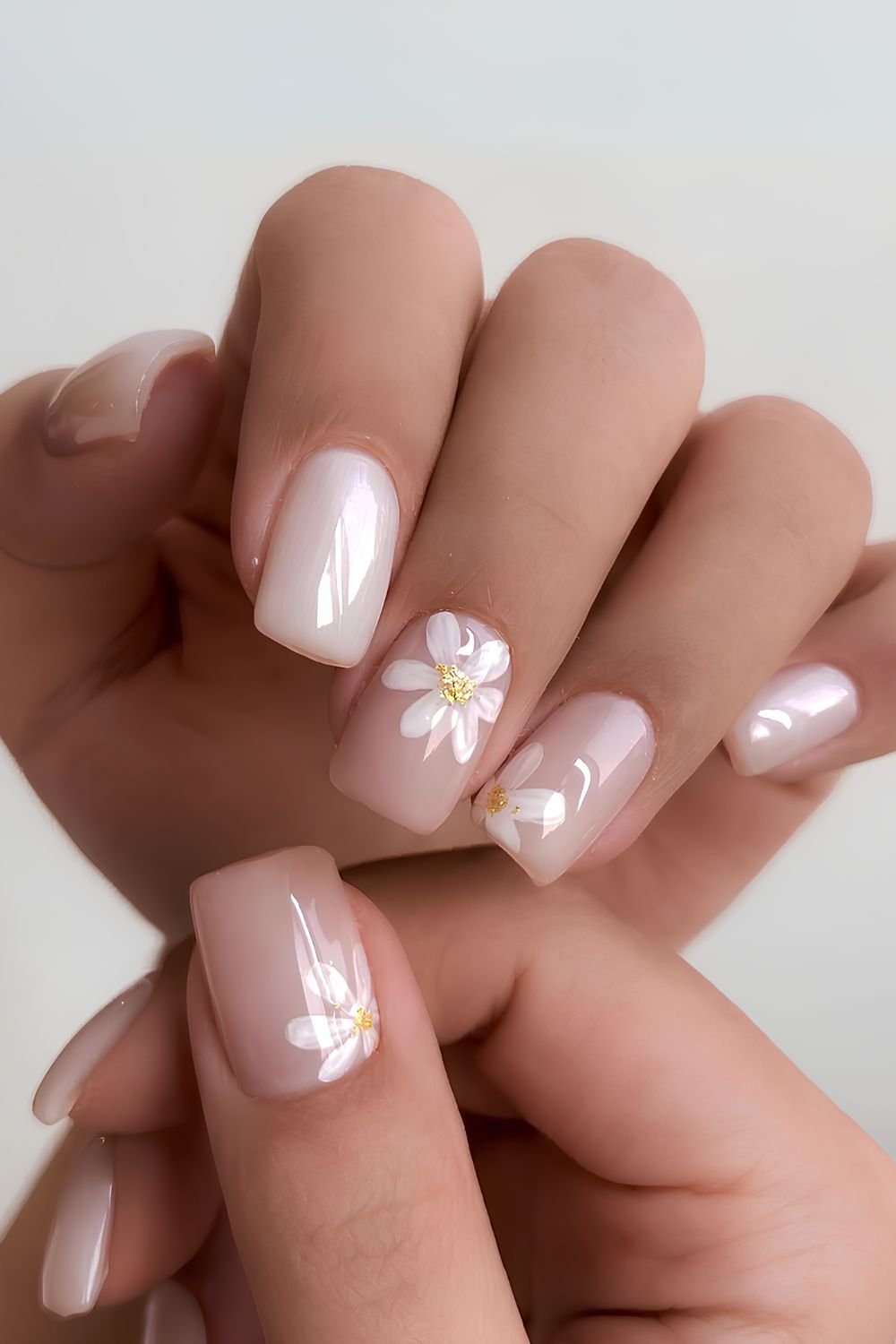 Milky white nails with daisy flower art