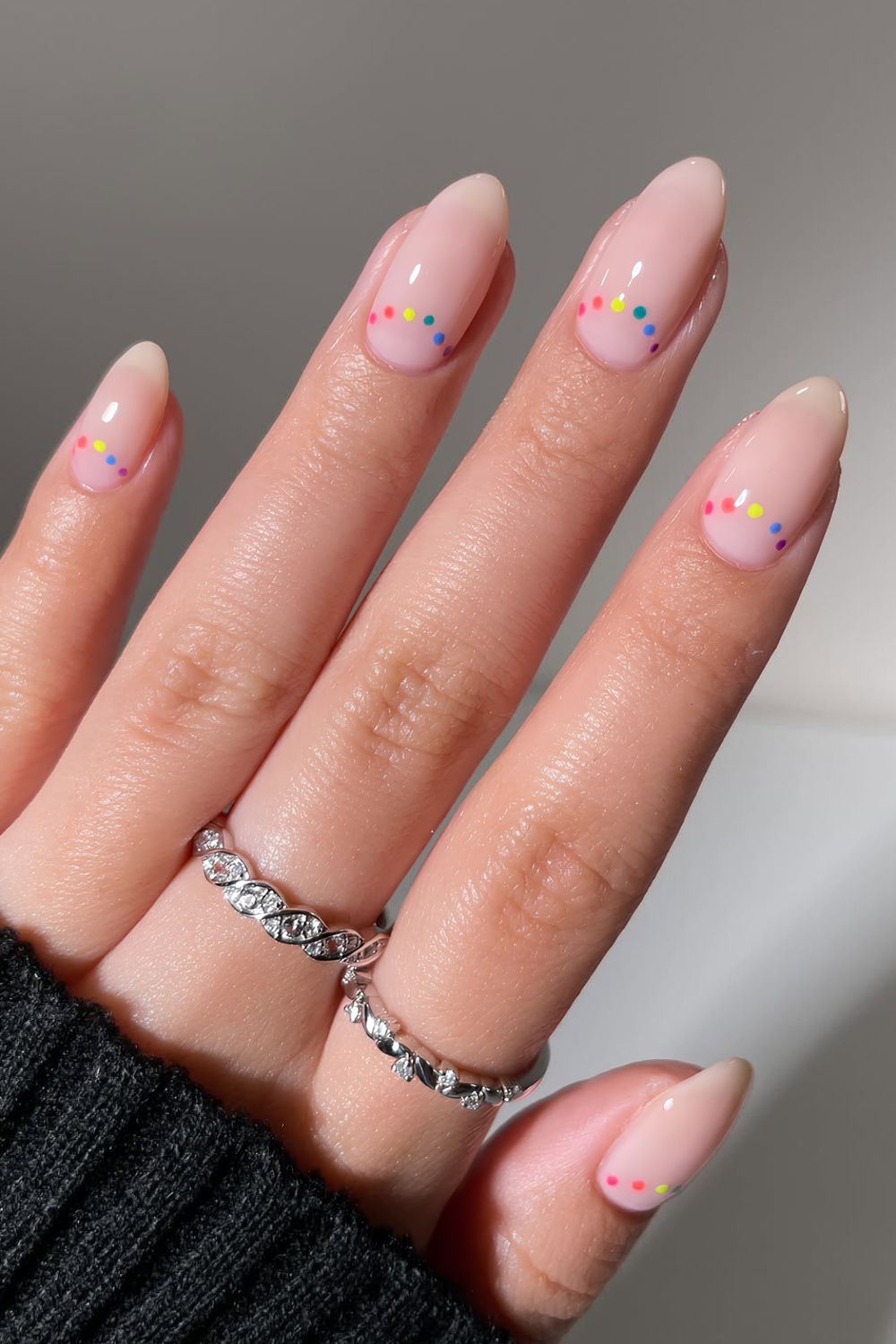 Milky white nails with dotted half moon design